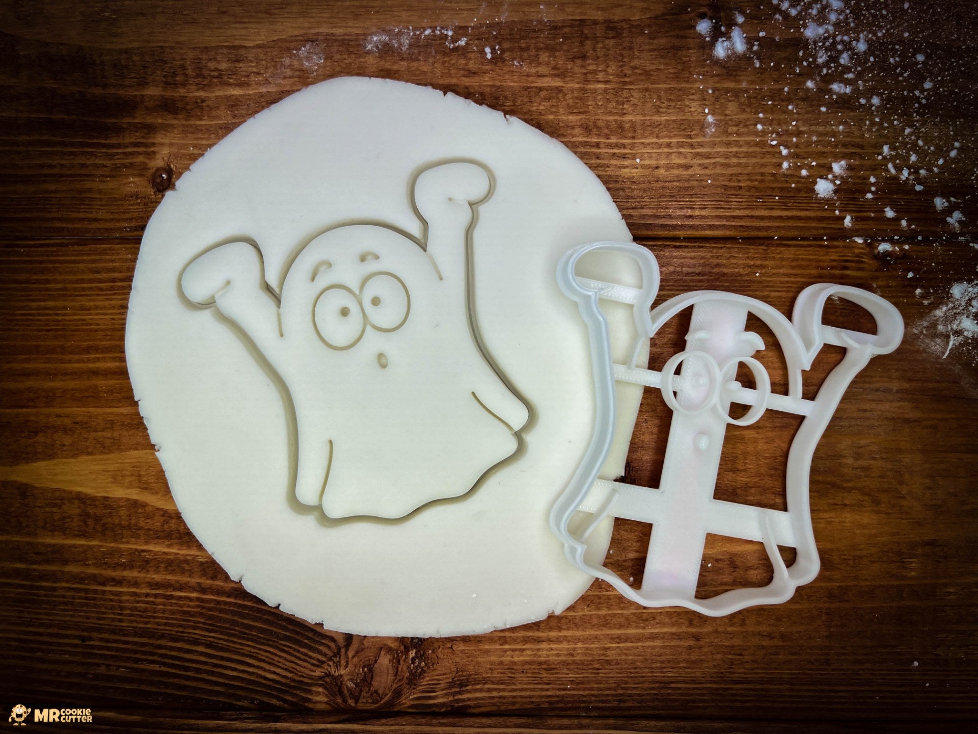 Halloween Ghost Cookie Cutter on a wood background