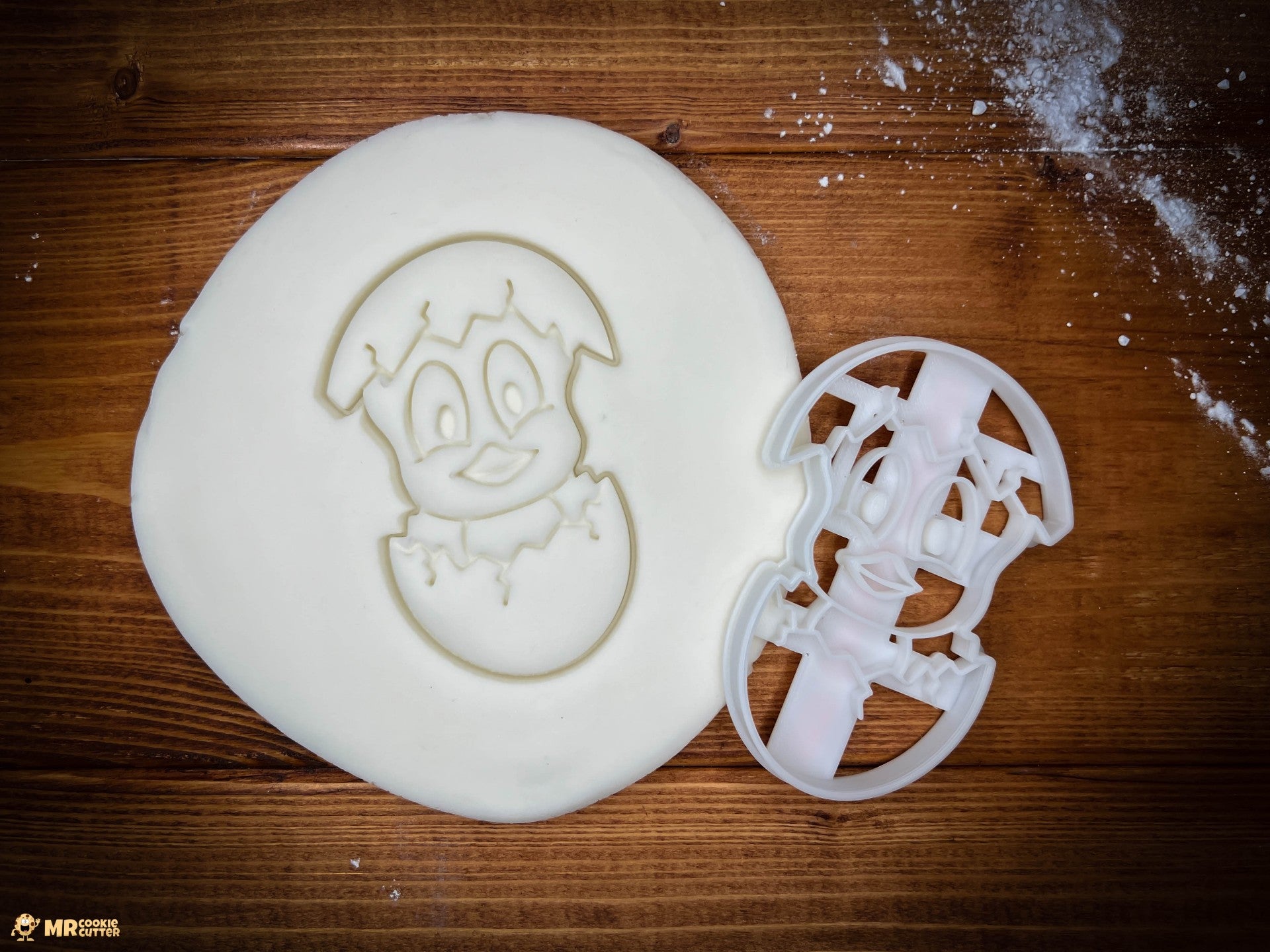 Easter Chick Cookie Cutter on a wood worktop