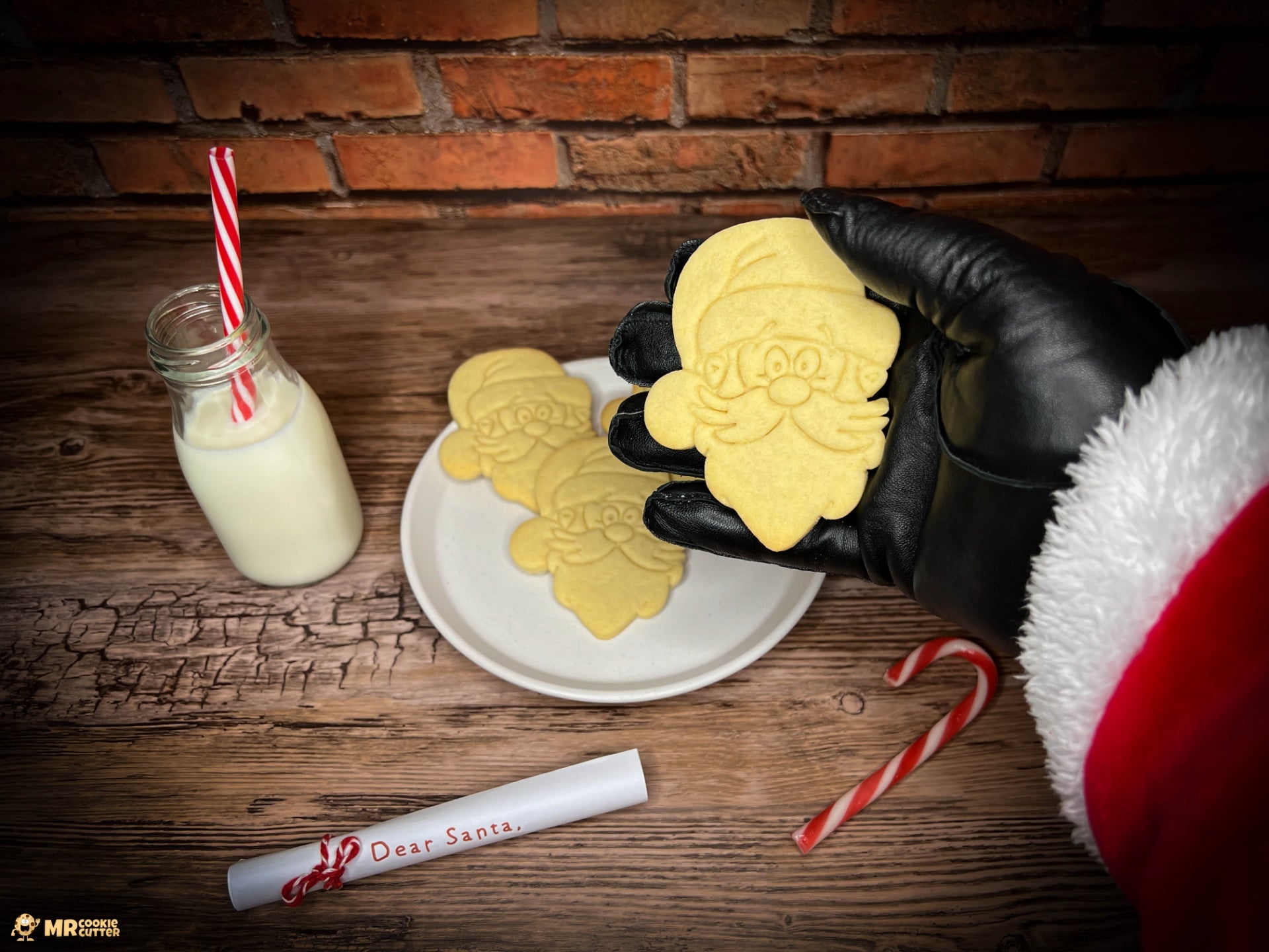 Santa Claus holding a Santa cookie